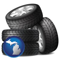 mi map icon and four tires with alloy wheels