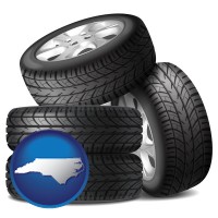 nc map icon and four tires with alloy wheels