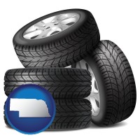 ne map icon and four tires with alloy wheels