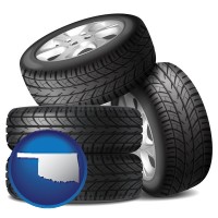 ok map icon and four tires with alloy wheels