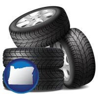 or map icon and four tires with alloy wheels