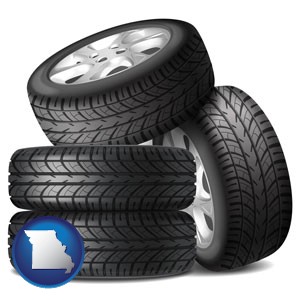 four tires with alloy wheels - with Missouri icon