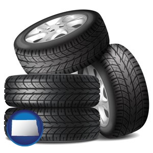 four tires with alloy wheels - with North Dakota icon