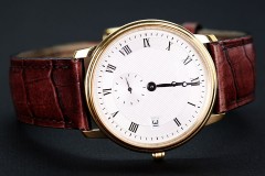 a classic wristwatch with leather watchband