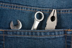 mechanic tools in a blue jeans pocket