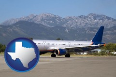 texas map icon and commercial aircraft at an airport, with mountainous background