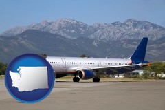 washington map icon and commercial aircraft at an airport, with mountainous background