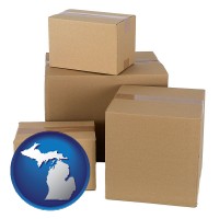 michigan map icon and a stack of cardboard boxes