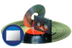 colorado map icon and an audio compact disc, a compact cassette, and a vinyl record