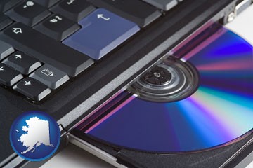 loading software into a laptop computer from a cd - with Alaska icon
