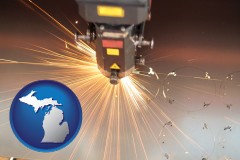 michigan map icon and a laser cutting tool
