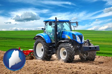 a blue farm tractor and a red cultivator - with Maine icon