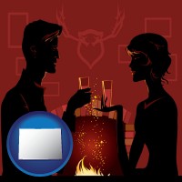 colorado map icon and a romantic fireplace setting