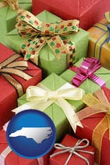 north-carolina map icon and wrapped holiday gifts