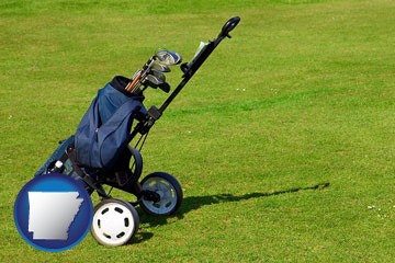 a golf bag on a green fairway - with Arkansas icon