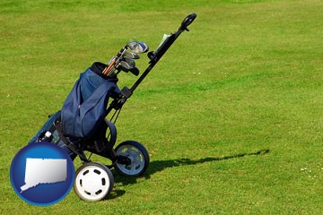 a golf bag on a green fairway - with Connecticut icon