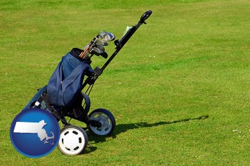 a golf bag on a green fairway - with Massachusetts icon