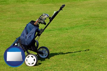 a golf bag on a green fairway - with North Dakota icon
