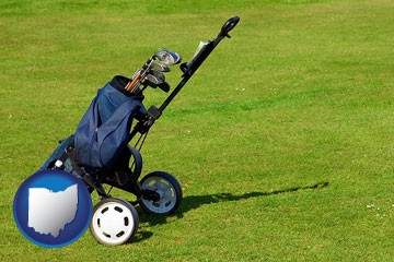 a golf bag on a green fairway - with Ohio icon