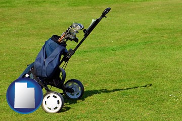 a golf bag on a green fairway - with Utah icon