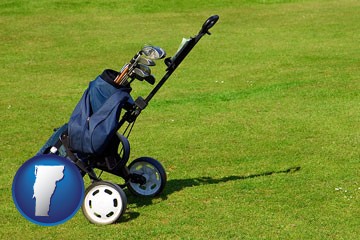 a golf bag on a green fairway - with Vermont icon