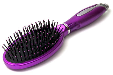 a purple hairbrush