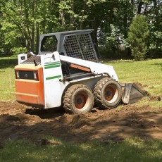 landscaping equipment (a skid-steer loader)