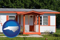 north-carolina map icon and a mobile home with orange trim
