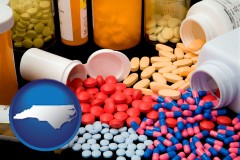 north-carolina map icon and pharmaceutical products