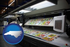 north-carolina map icon and a commercial offset printing press