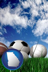 georgia map icon and a football, a golf ball, a soccer ball, a tennis ball, and a volleyball