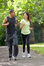 sportswear-attired joggers in a park