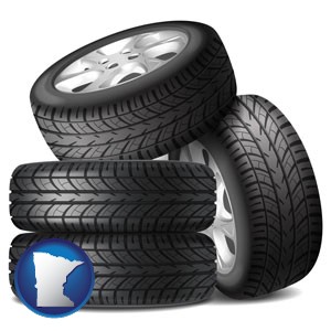 four tires with alloy wheels - with Minnesota icon